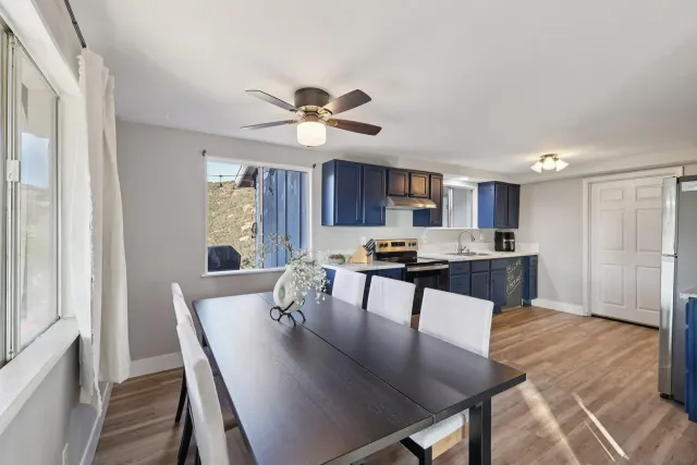 a view of a dry yard with wooden fence