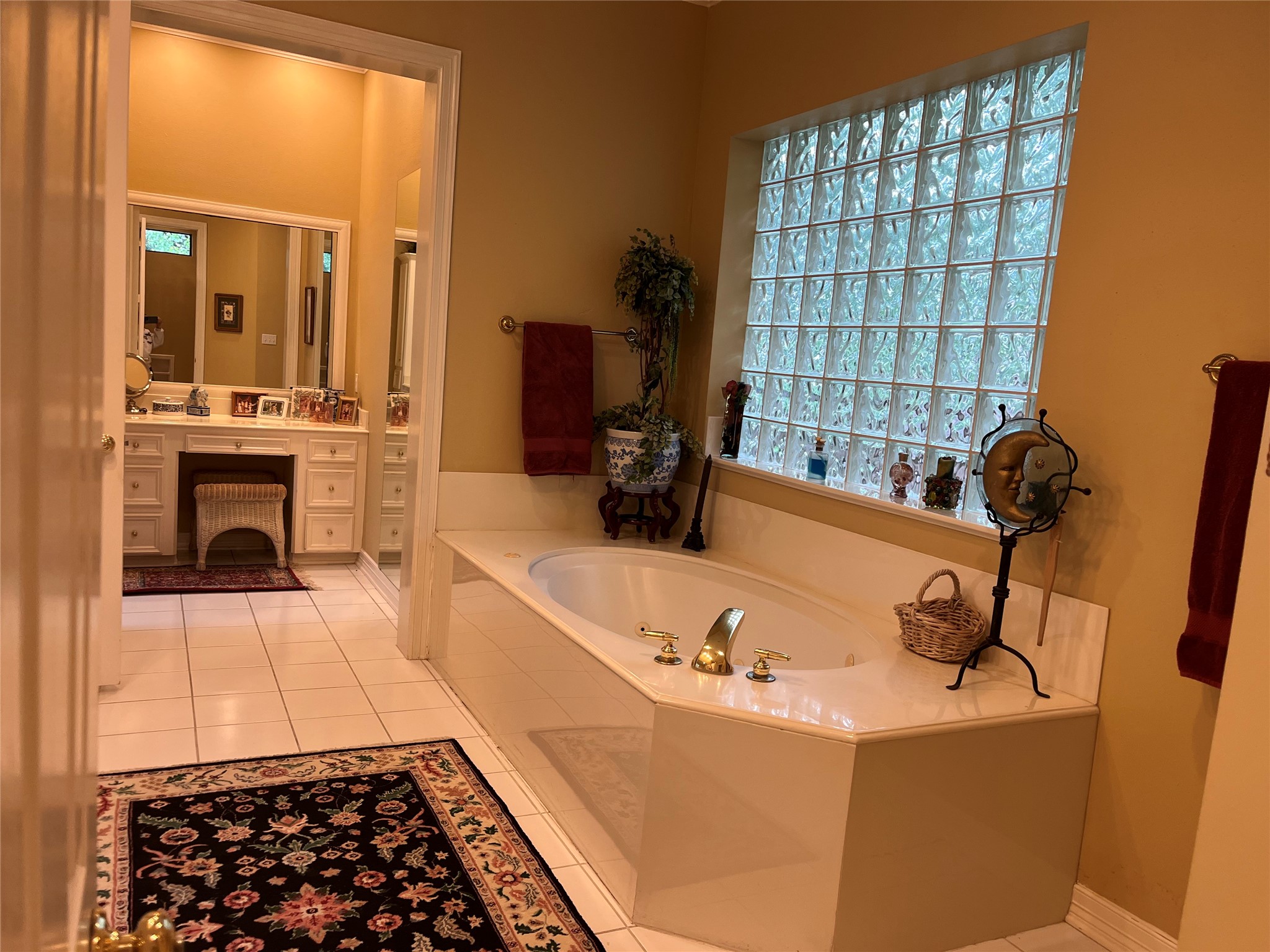 24602 West Kingscrest Circle Spring, TX 77389 - Photo 13 of 20 a bathroom with a tub sink and mirror
