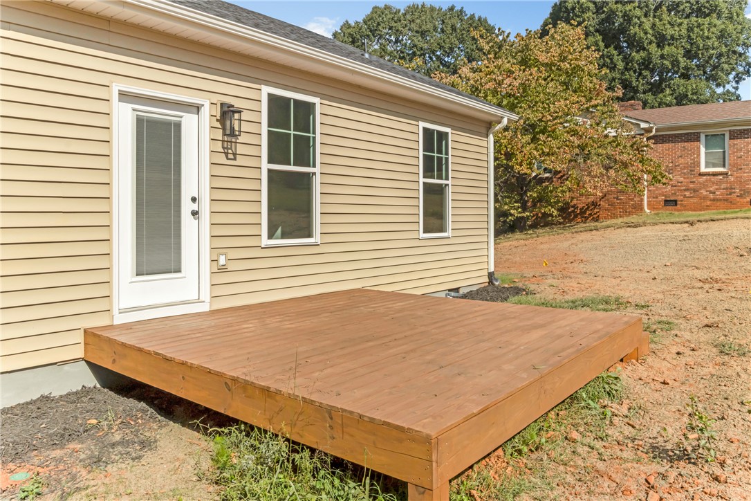 1115 Marshall Road Anderson, SC 29626 - Photo 30 of 35 An inviting wooden deck extends from the back of the vinyl-sided home.