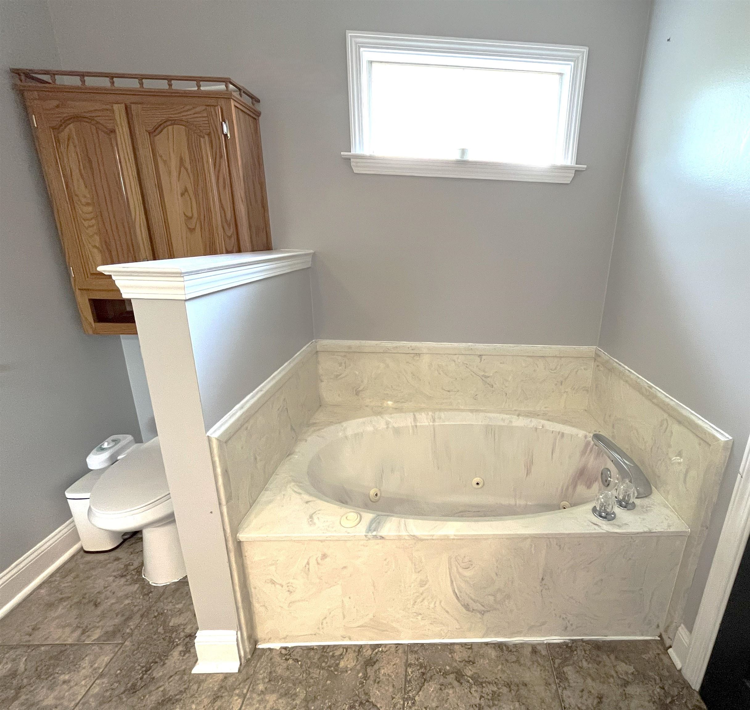 4020 Meade Lake Road Millington, TN 38053 - Photo 17 of 23 Bathroom with a tub and toilet