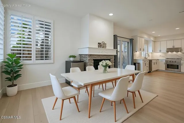 a view of a dining room with furniture and window