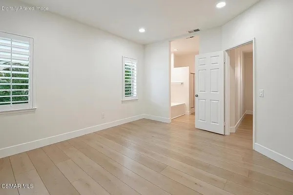 a bathroom with a shower and a toilet