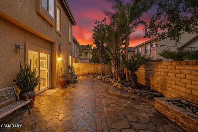 a view of a swimming pool with a table and chairs