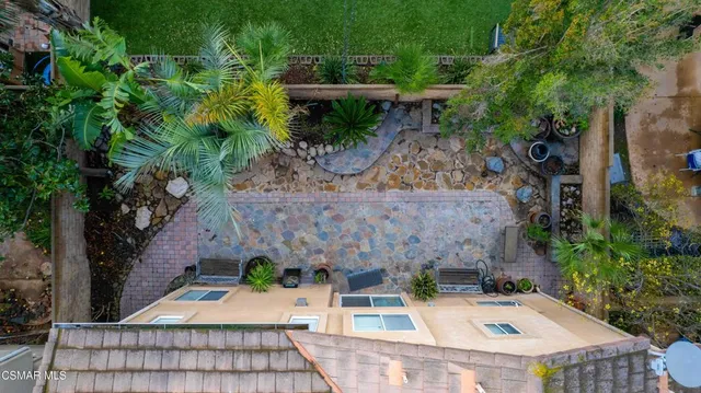 a view of a big yard with a house in the background