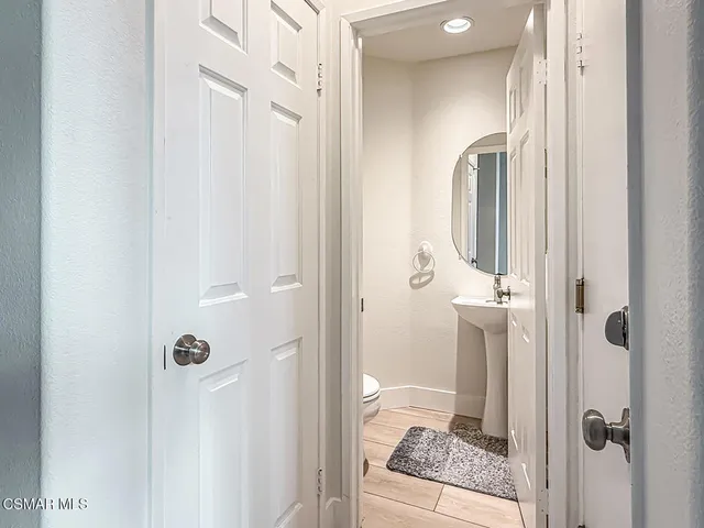 a bathroom with a granite countertop shower