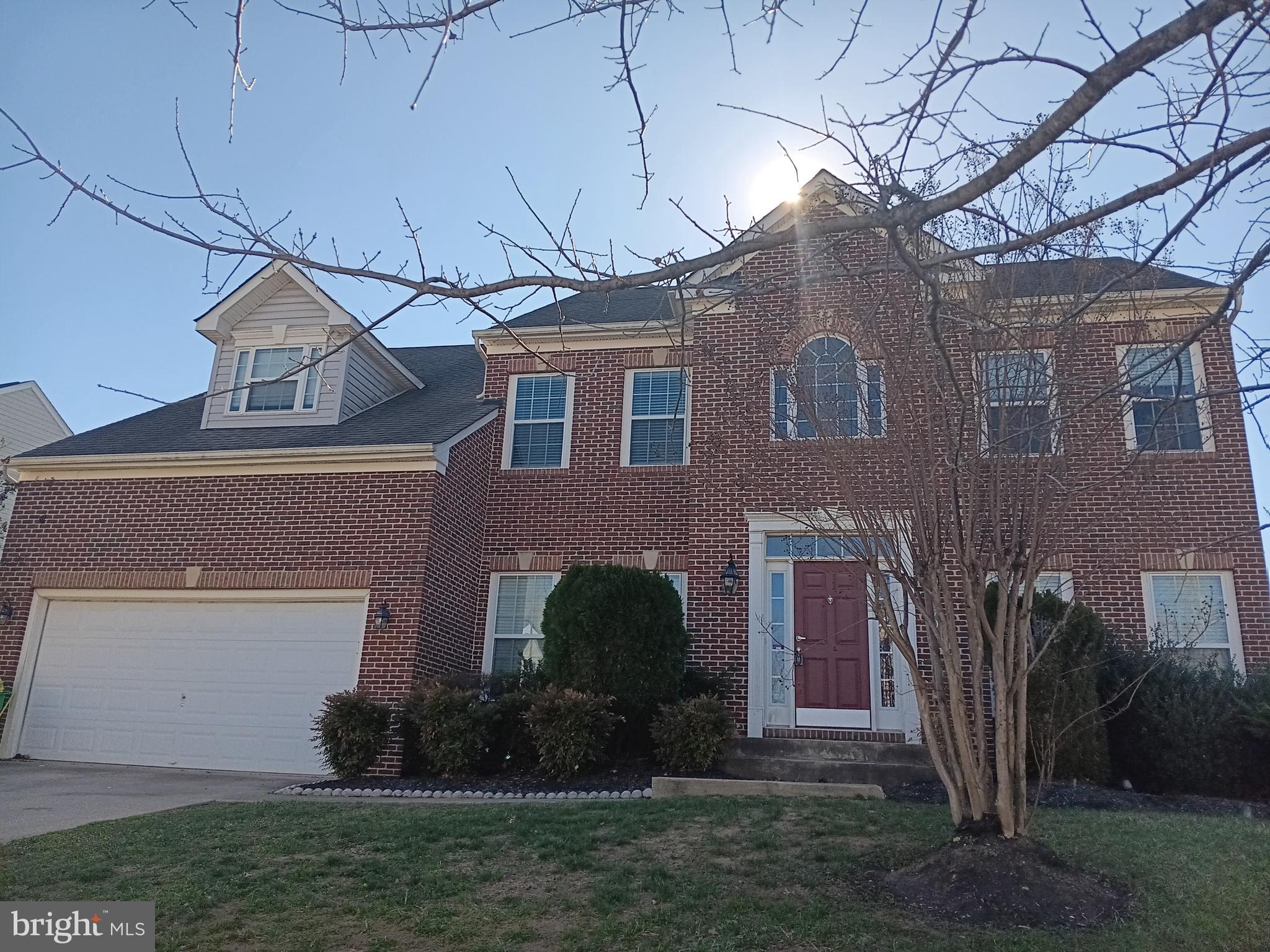 9707 Risen Star Drive Upper Marlboro, MD 20772 - Photo 1 of 35 a front view of a house with a garden