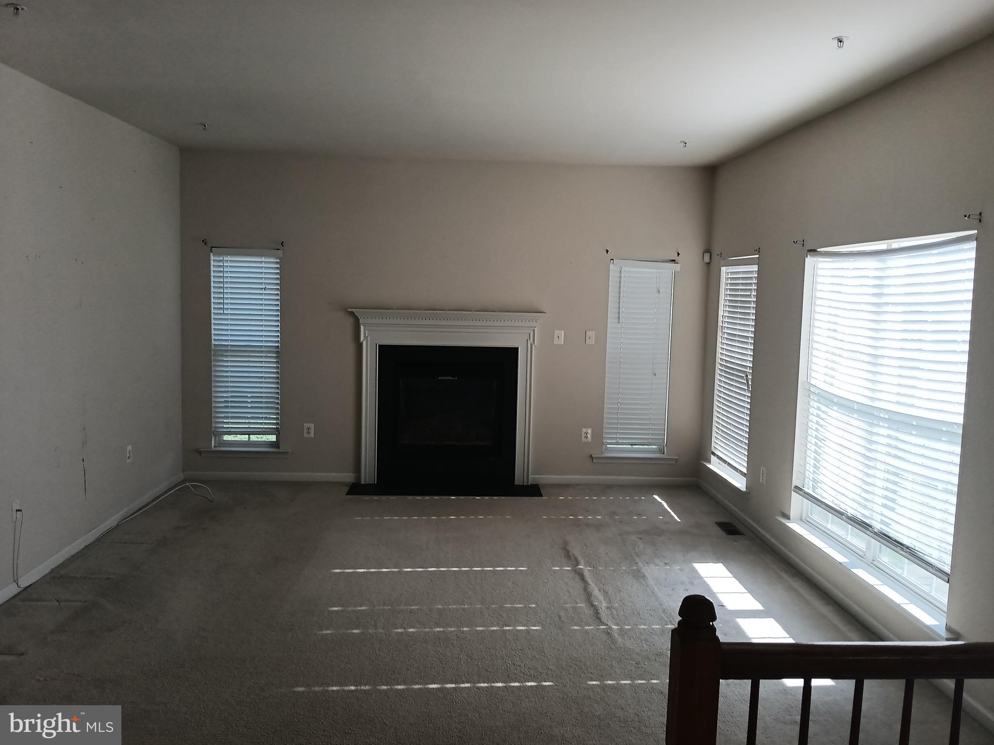 9707 Risen Star Drive Upper Marlboro, MD 20772 - Photo 12 of 35 a view of an empty room with a fireplace and a window