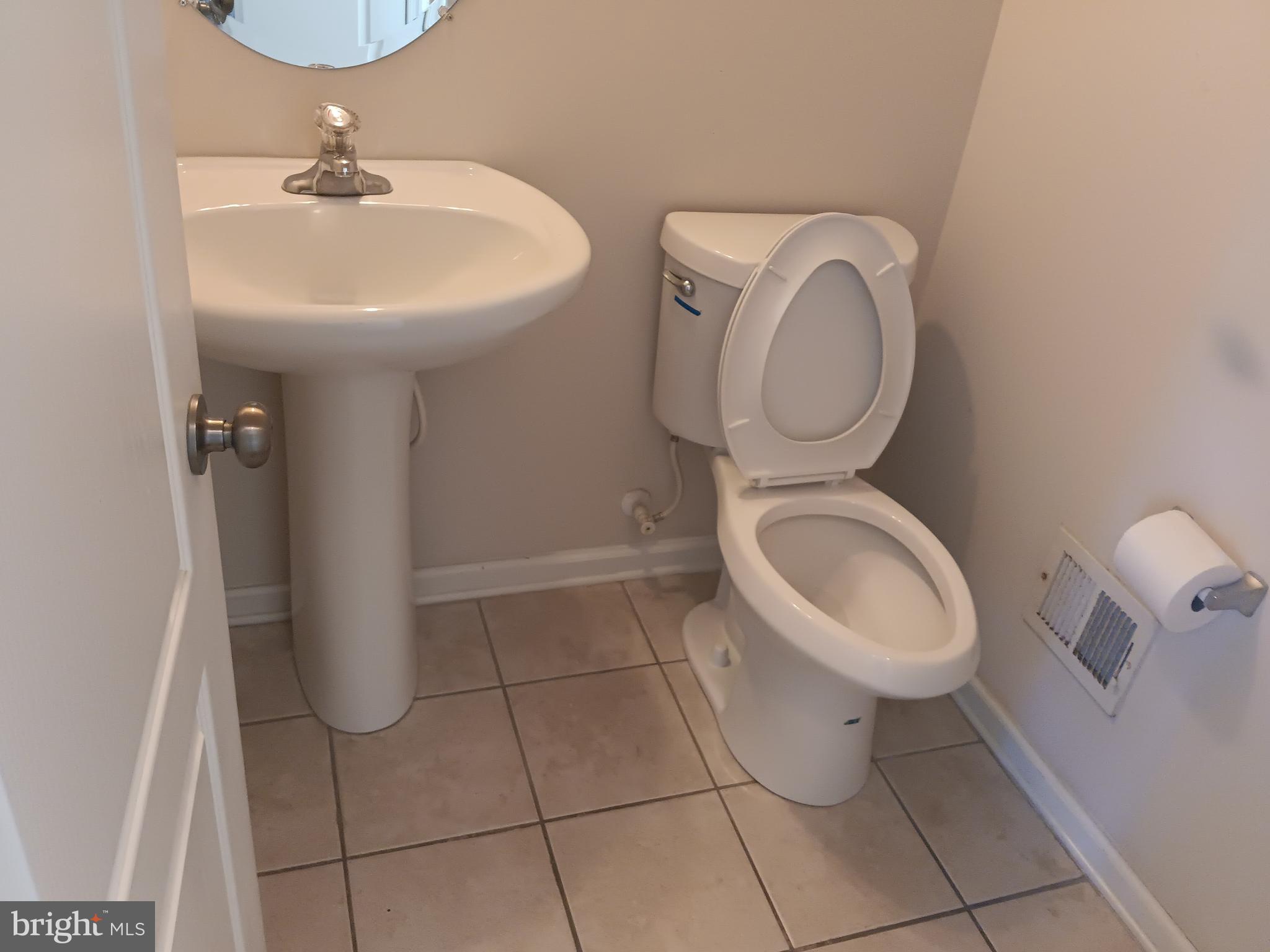 9707 Risen Star Drive Upper Marlboro, MD 20772 - Photo 14 of 35 a bathroom with a sink toilet and a mirror
