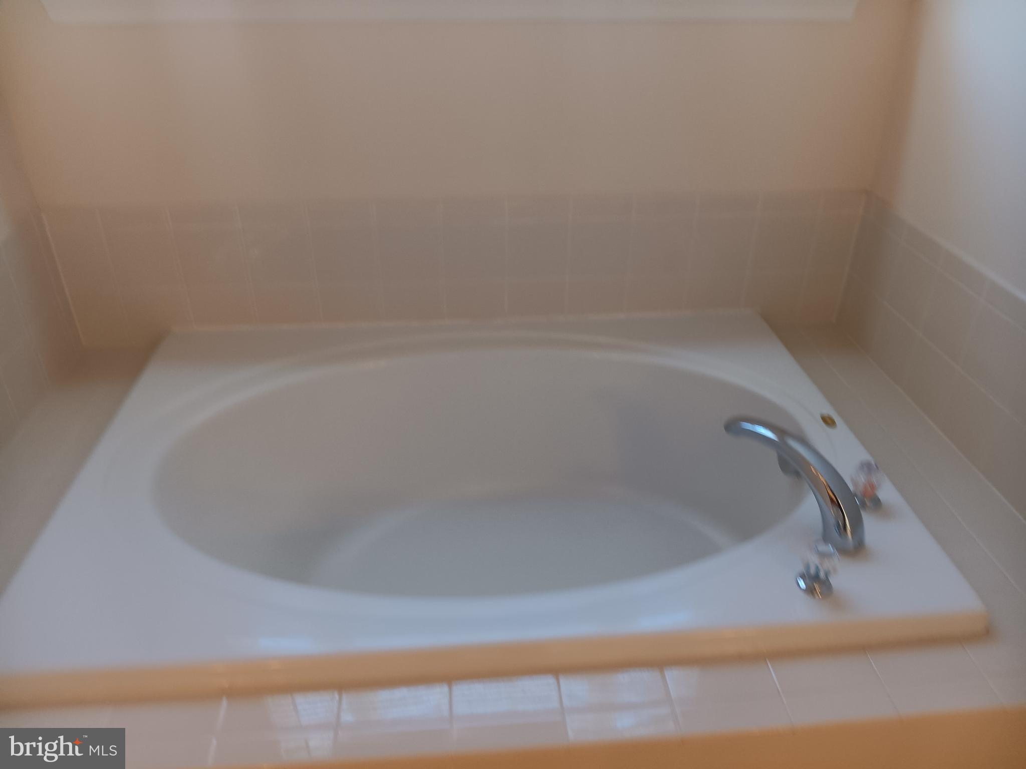 9707 Risen Star Drive Upper Marlboro, MD 20772 - Photo 28 of 35 a close up of a bathtub