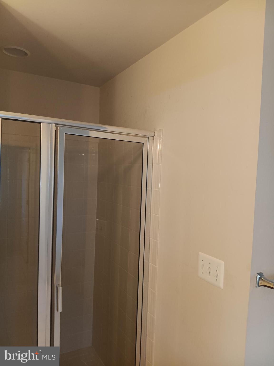 9707 Risen Star Drive Upper Marlboro, MD 20772 - Photo 35 of 35 a bathroom with a shower and a mirror