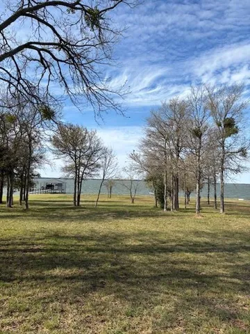 a view of a playground with green space