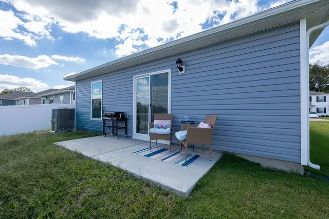 a view of backyard with a garden and outdoor seating
