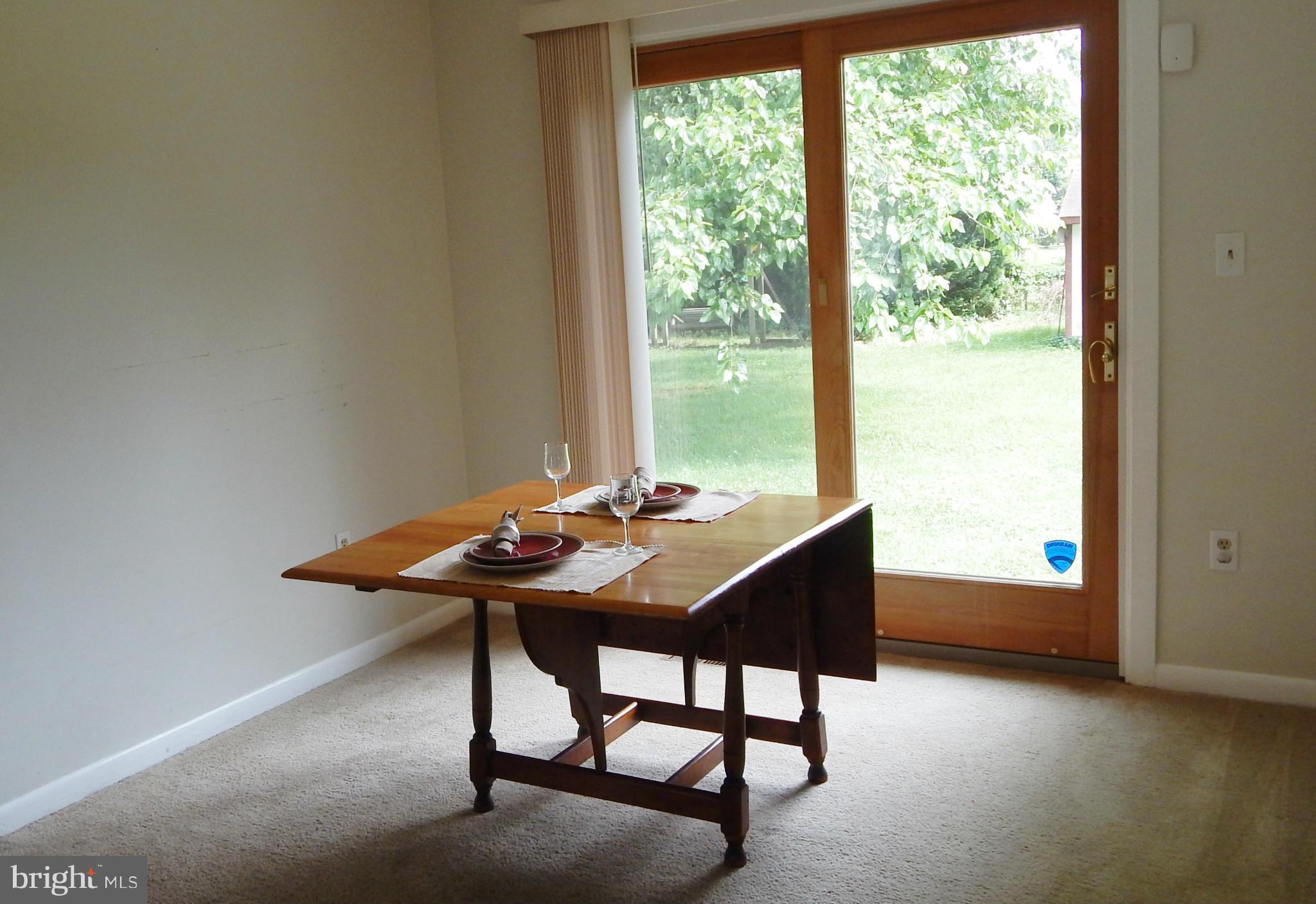 785 Evergreen Road Severn, MD 21144 - Photo 13 of 25 a table and chairs in a room