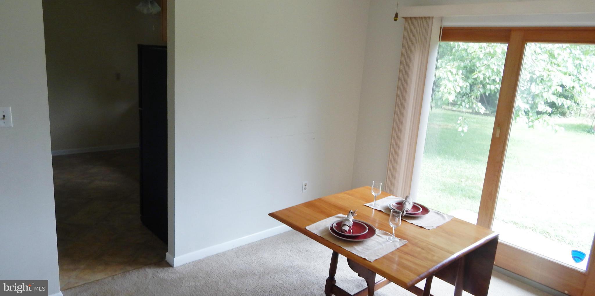 785 Evergreen Road Severn, MD 21144 - Photo 14 of 25 a view of a workspace with furniture and window
