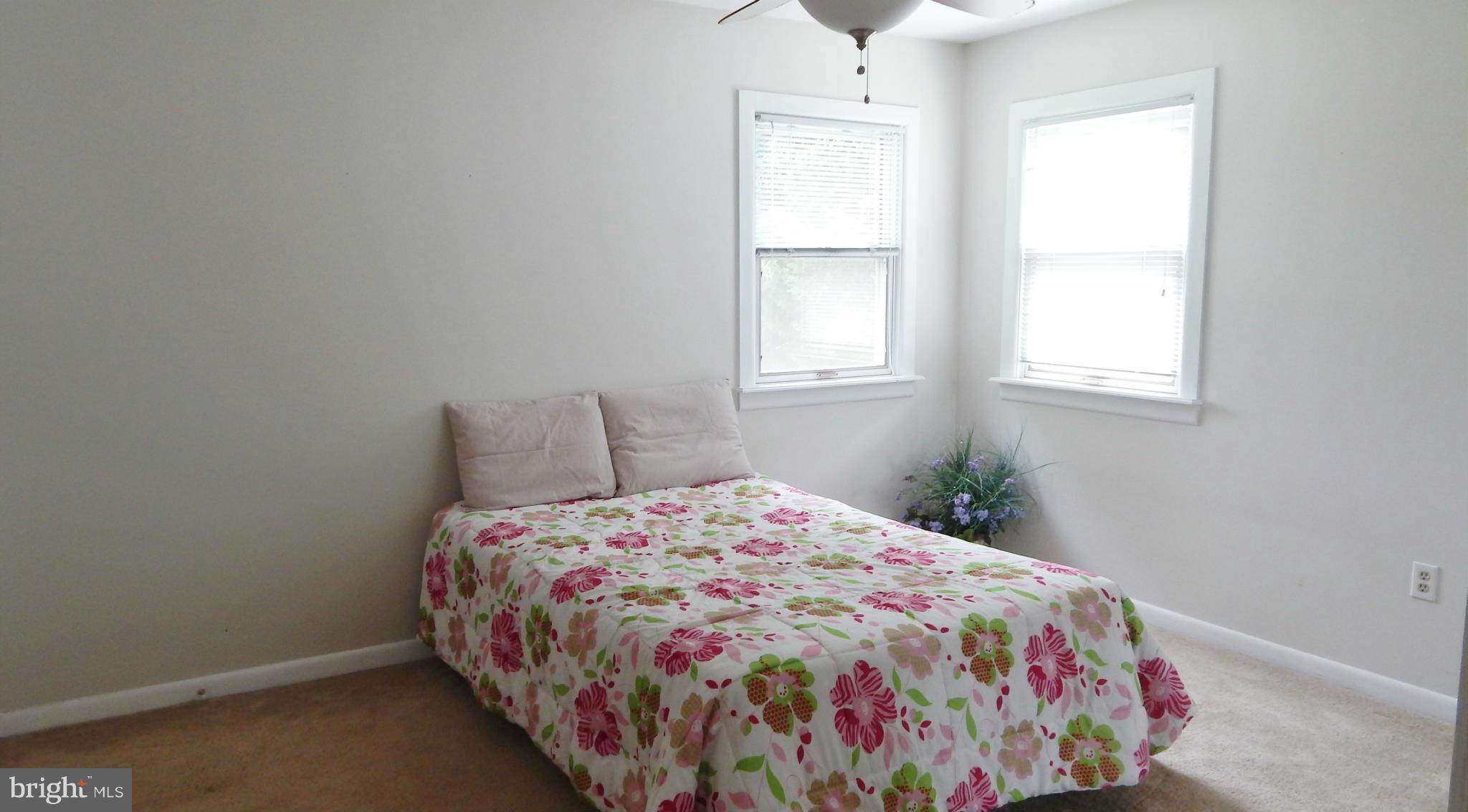 785 Evergreen Road Severn, MD 21144 - Photo 18 of 25 a bedroom with a bed and a window