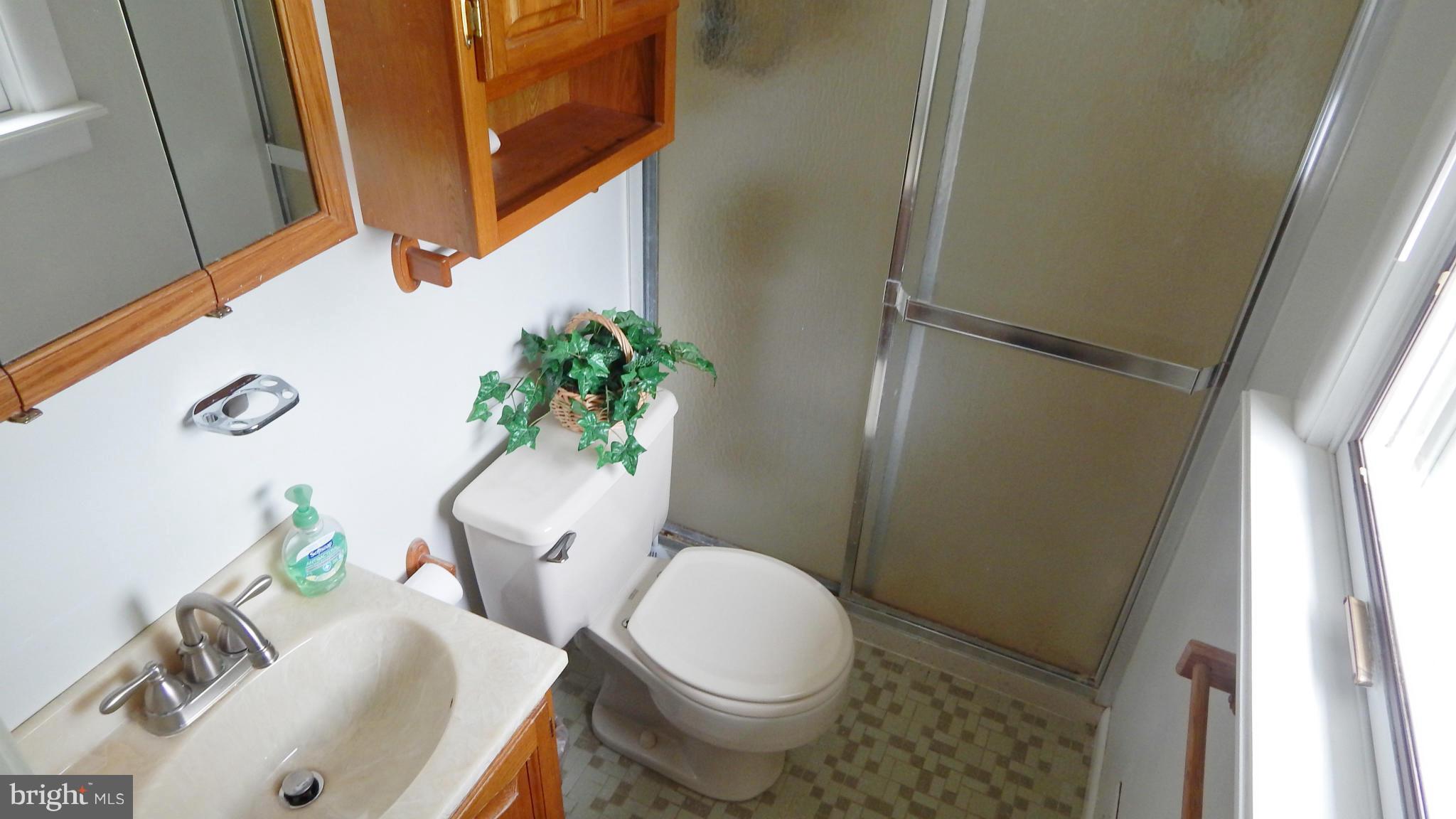 785 Evergreen Road Severn, MD 21144 - Photo 20 of 25 a white toilet sitting next to a sink and a tub