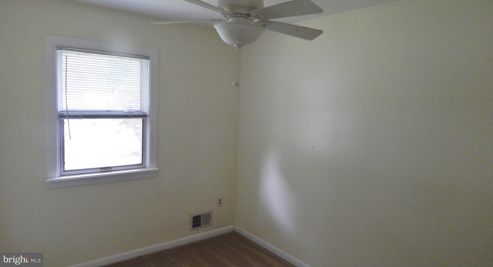 785 Evergreen Road Severn, MD 21144 - Photo 22 of 25 an empty room with a window