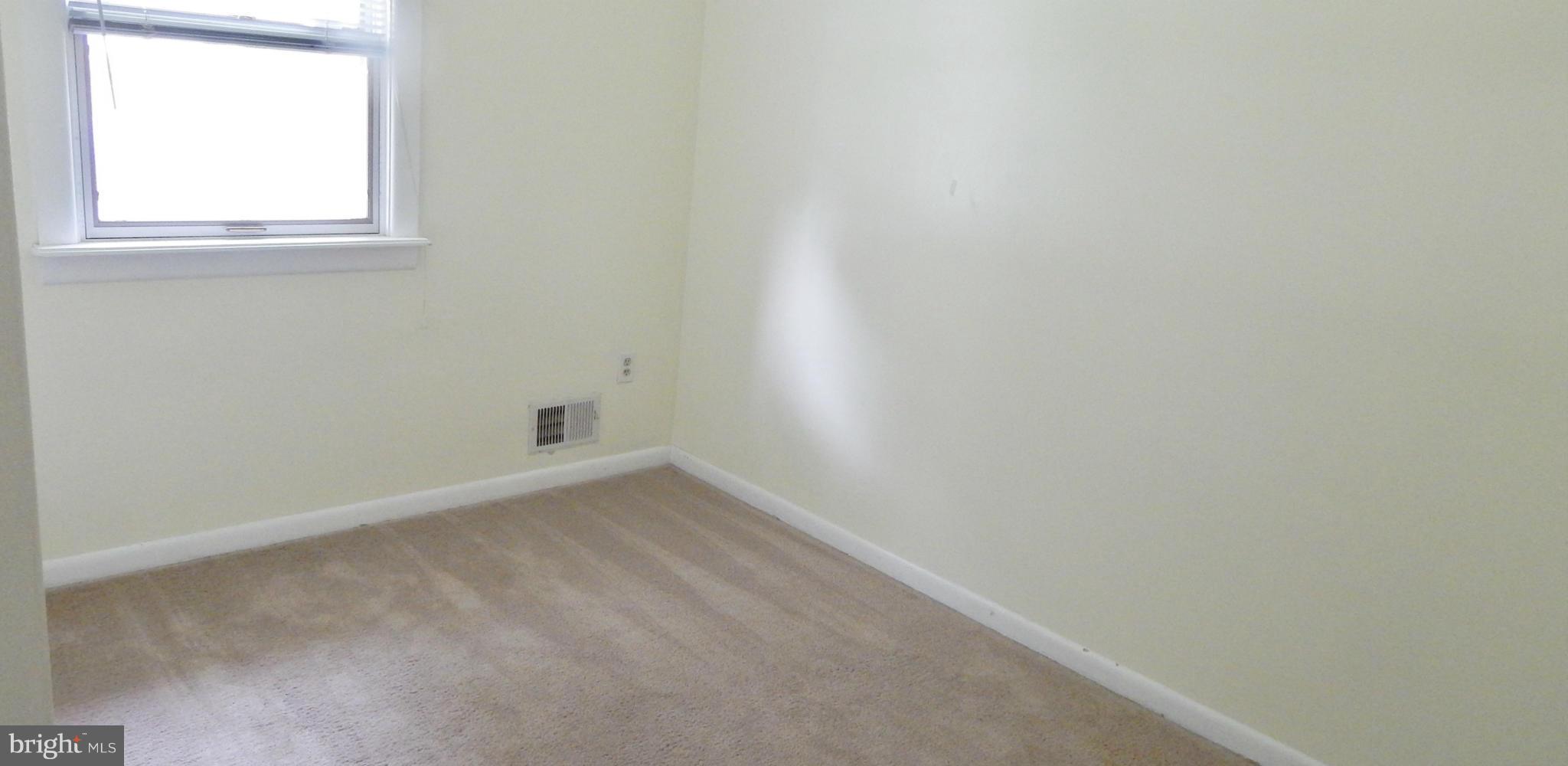 785 Evergreen Road Severn, MD 21144 - Photo 24 of 25 an empty room with a window