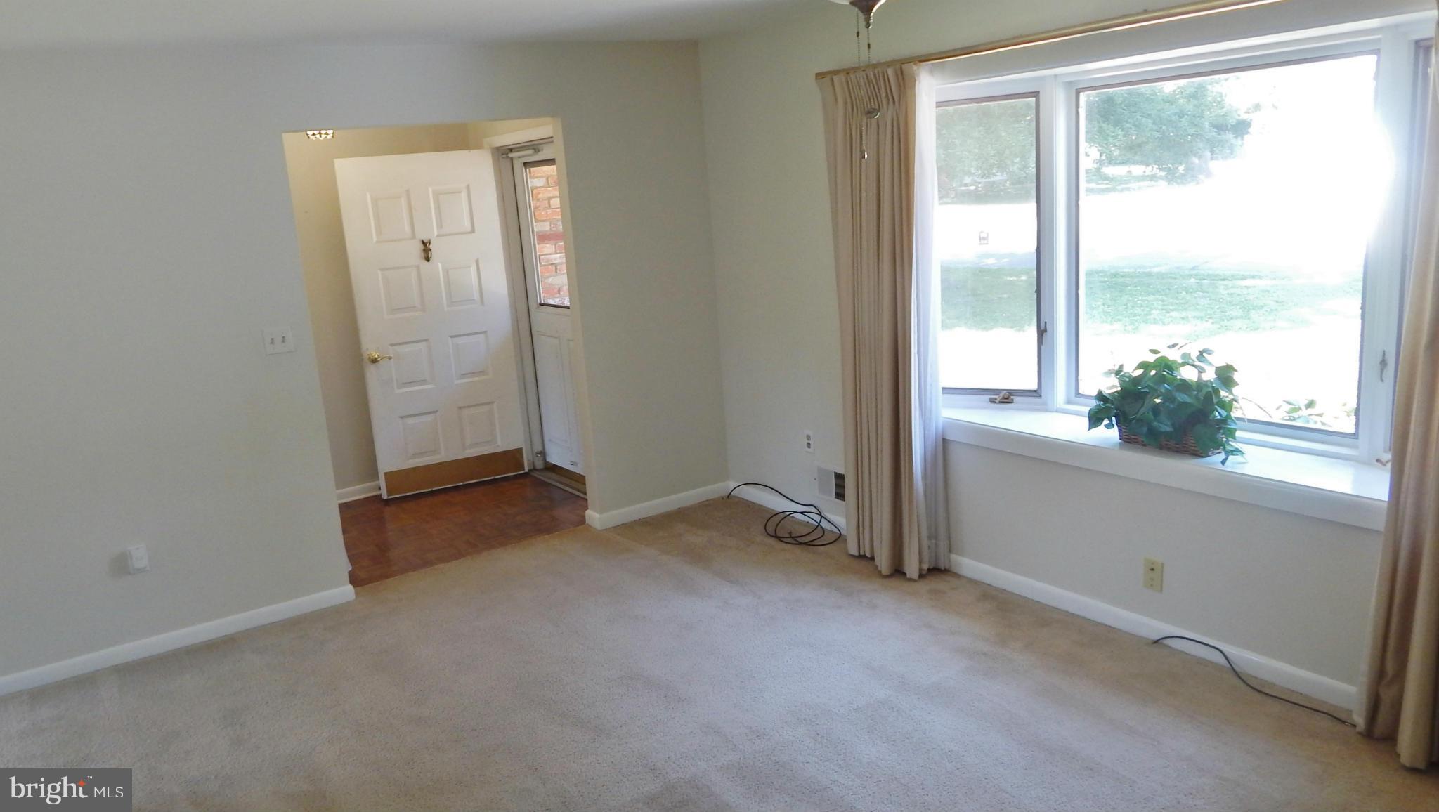 785 Evergreen Road Severn, MD 21144 - Photo 10 of 25 an empty room with windows