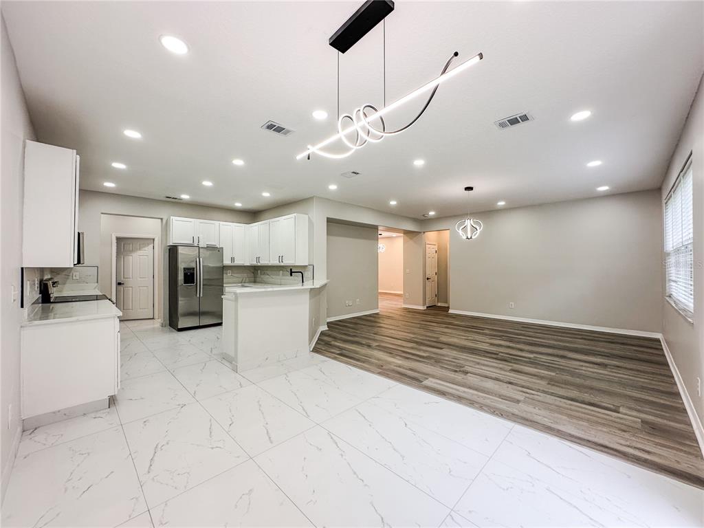 7322 Bridgeview Drive Wesley Chapel, FL 33545 - Photo 13 of 75 a view of kitchen with furniture and refrigerator