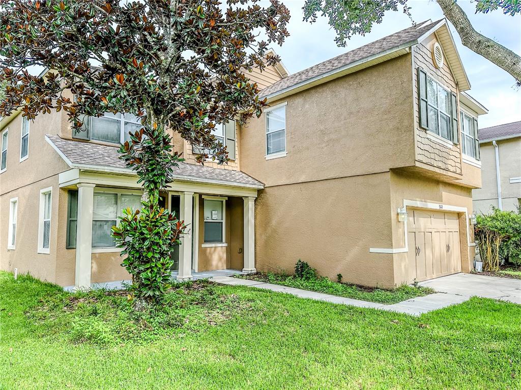 7322 Bridgeview Drive Wesley Chapel, FL 33545 - Photo 2 of 75 front view of a house with a yard