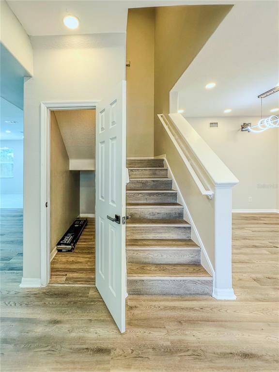 7322 Bridgeview Drive Wesley Chapel, FL 33545 - Photo 24 of 75 a view of a hallway with staircase