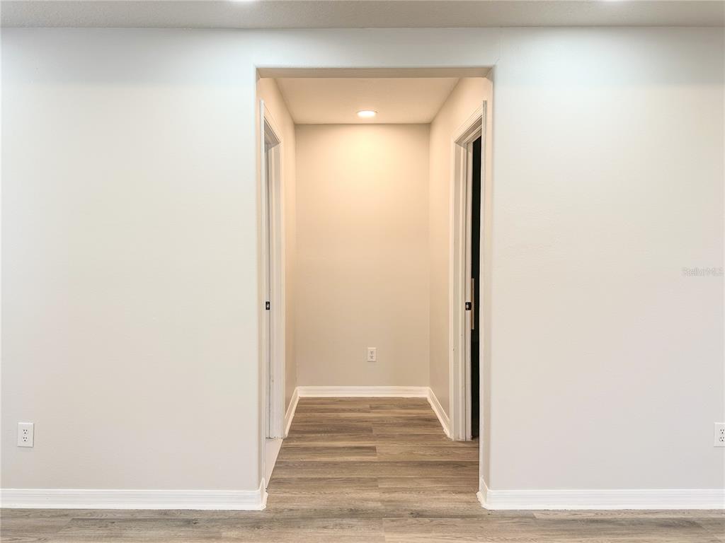 7322 Bridgeview Drive Wesley Chapel, FL 33545 - Photo 31 of 75 a view of a livingroom from a hallway