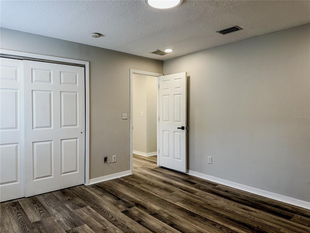 7322 Bridgeview Drive Wesley Chapel, FL 33545 - Photo 43 of 75 a view of a livingroom with wooden floor