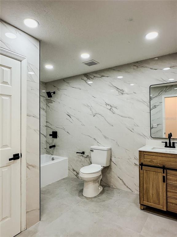 7322 Bridgeview Drive Wesley Chapel, FL 33545 - Photo 48 of 75 a bathroom with a sink toilet and shower
