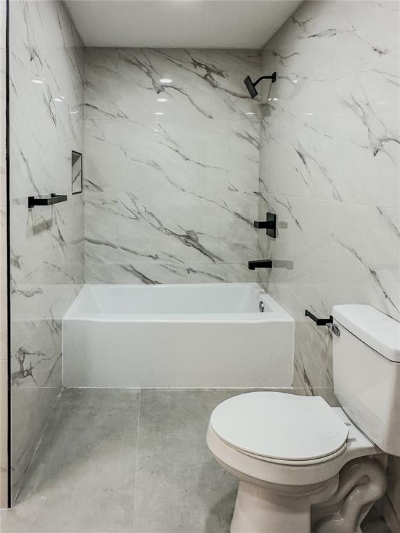 7322 Bridgeview Drive Wesley Chapel, FL 33545 - Photo 49 of 75 a bathroom with a toilet and a shower