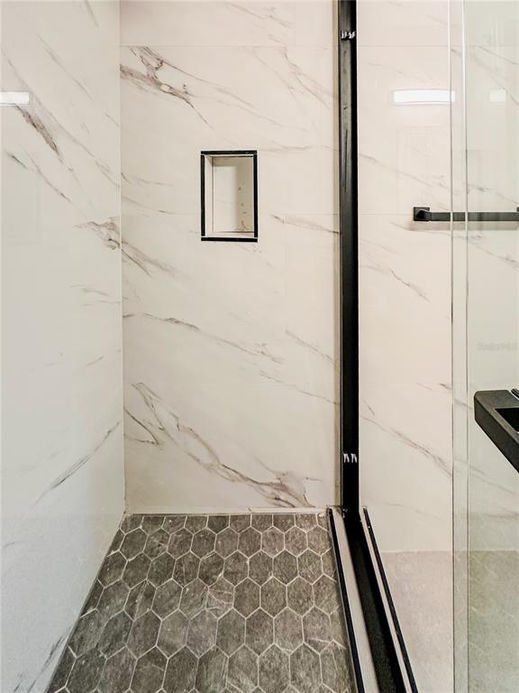 7322 Bridgeview Drive Wesley Chapel, FL 33545 - Photo 62 of 75 a bathroom with a shower