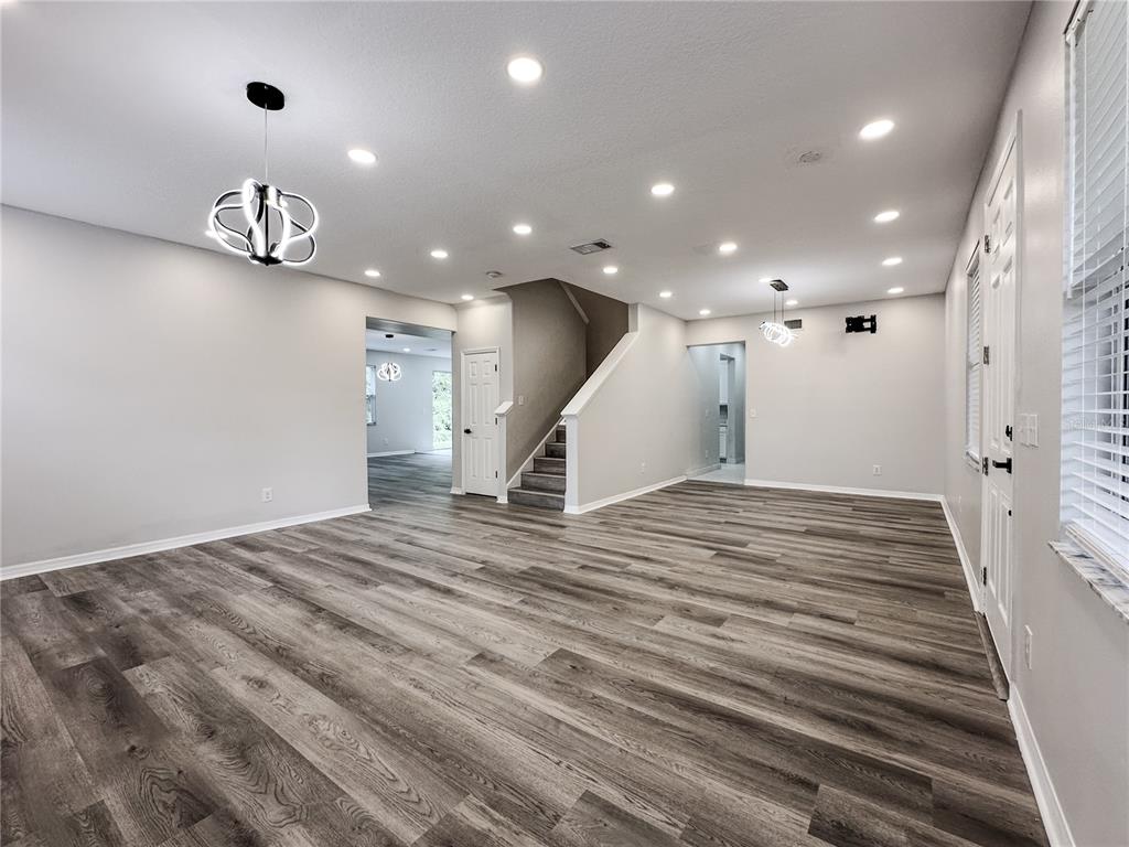 7322 Bridgeview Drive Wesley Chapel, FL 33545 - Photo 10 of 75 a view of a hallway with stairs and a window