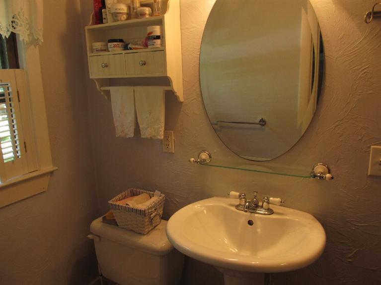 150 Pimlico Pond Road Mashpee, MA 02649 - Photo 12 of 26 a bathroom with a sink and mirror
