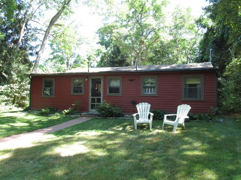 150 Pimlico Pond Road Mashpee, MA 02649 - Photo 16 of 26 a view of backyard of house with outdoor seating and green space