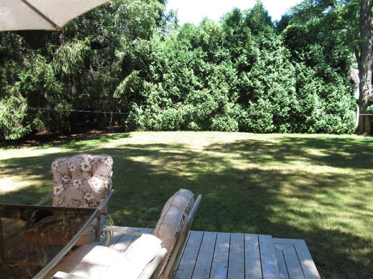 150 Pimlico Pond Road Mashpee, MA 02649 - Photo 18 of 26 a view of a wooden deck with a yard