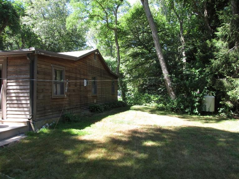 150 Pimlico Pond Road Mashpee, MA 02649 - Photo 21 of 26 a backyard of a house with lots of green space