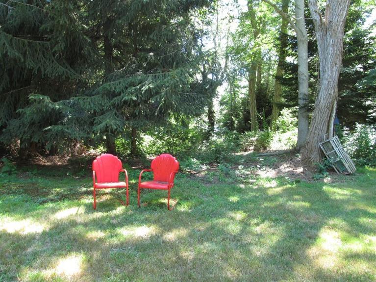 150 Pimlico Pond Road Mashpee, MA 02649 - Photo 23 of 26 a view of a table and chairs in the garden