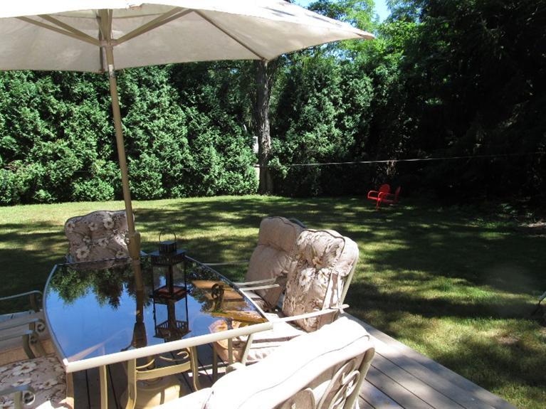 150 Pimlico Pond Road Mashpee, MA 02649 - Photo 4 of 26 a view of a backyard with sitting area