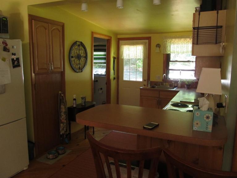 150 Pimlico Pond Road Mashpee, MA 02649 - Photo 7 of 26 a view of a dining room with furniture