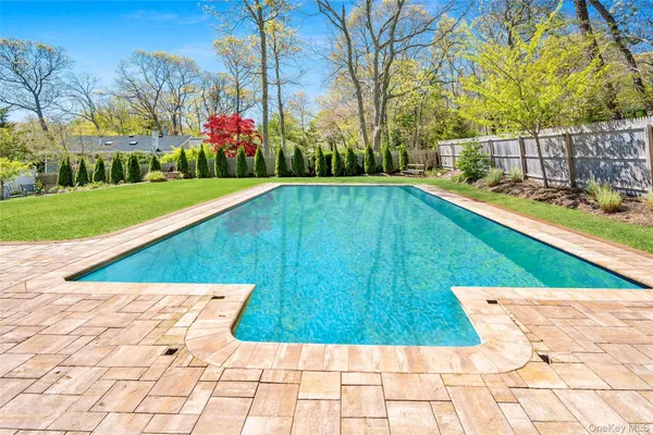 a view of swimming pool with a yard