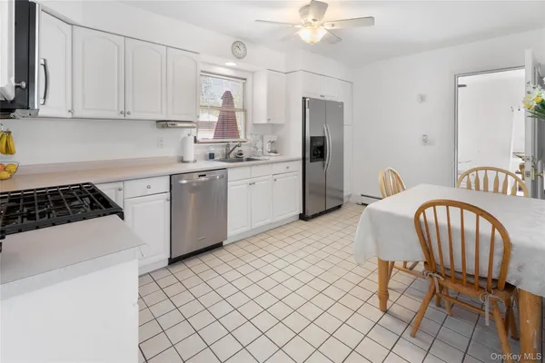 a kitchen with sink cabinets and window
