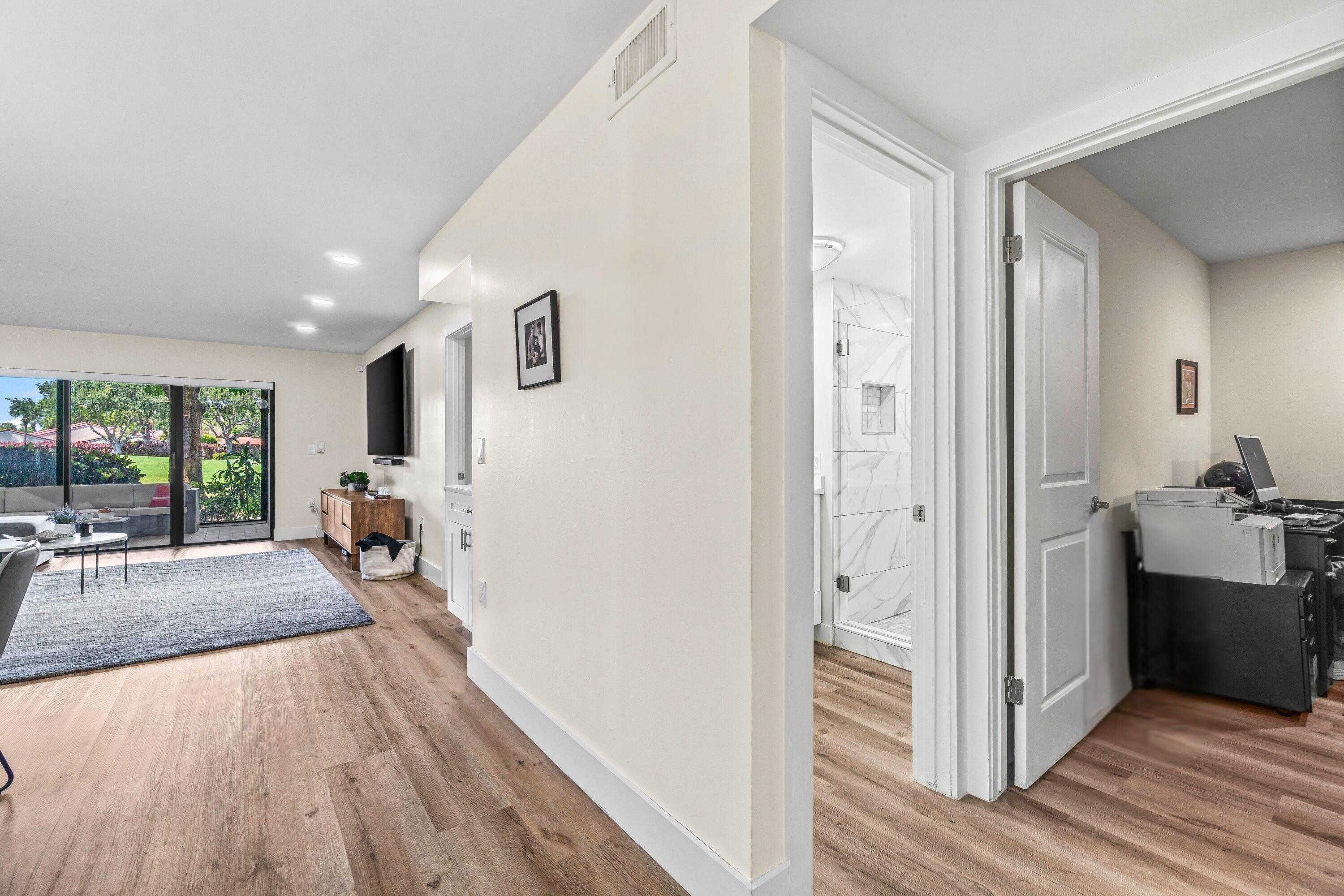 18 Stratford Drive, Unit E Boynton Beach, FL 33436 - Photo 12 of 49 a view of a living room and bathroom