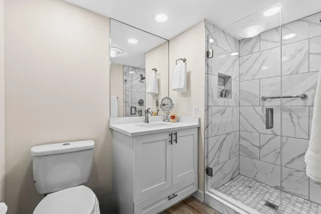 a view of a living room and bathroom