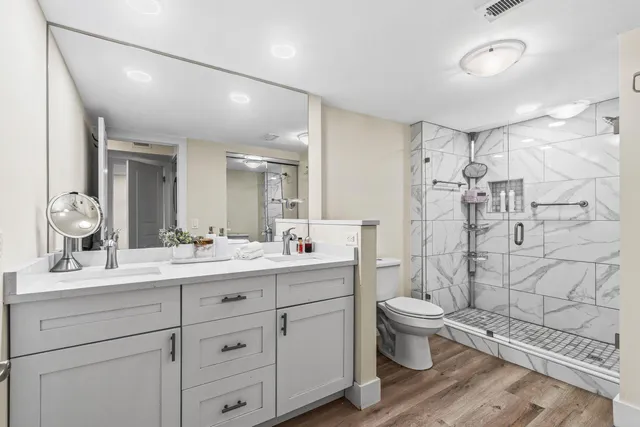 a bedroom with a large bed and a couch