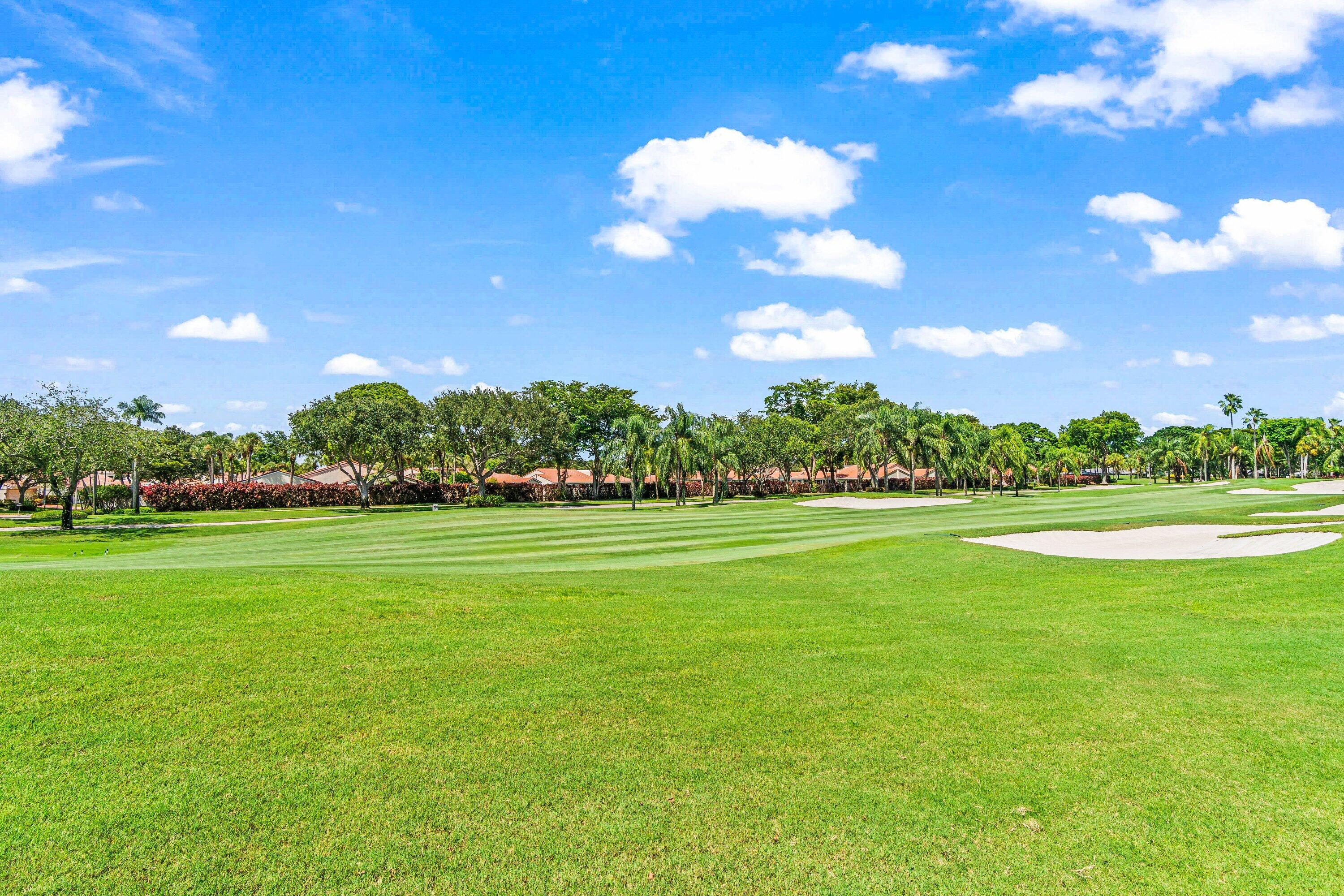 18 Stratford Drive, Unit E Boynton Beach, FL 33436 - Photo 23 of 49 a view of an outdoor space and yard