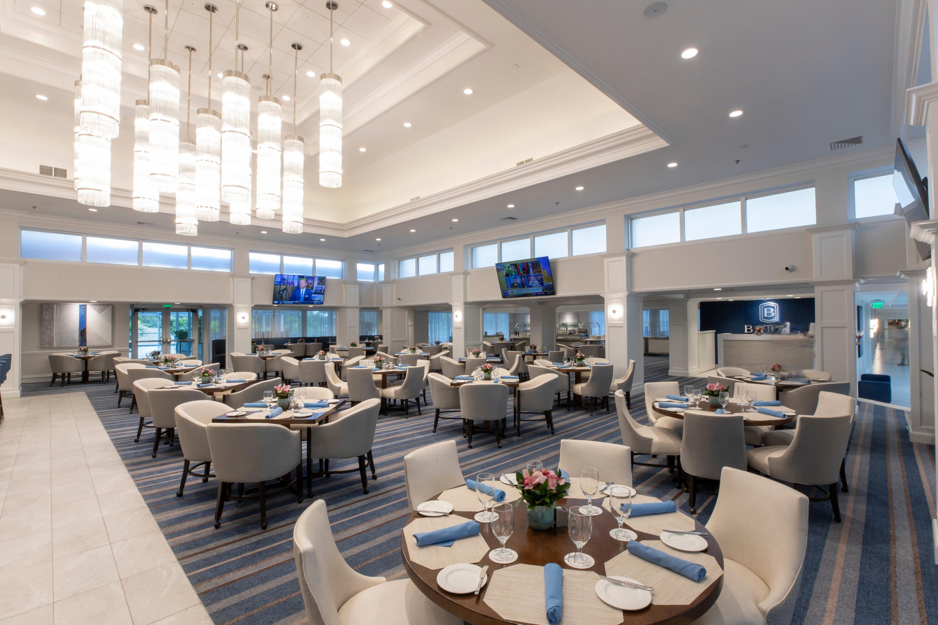 18 Stratford Drive, Unit E Boynton Beach, FL 33436 - Photo 40 of 49 a room with lots of white furniture