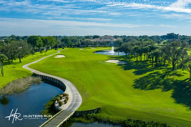 a view of a golf course with an ocean view
