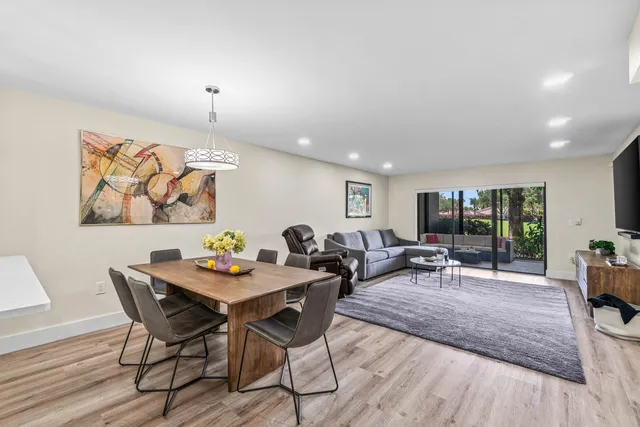 a living room with furniture and a table