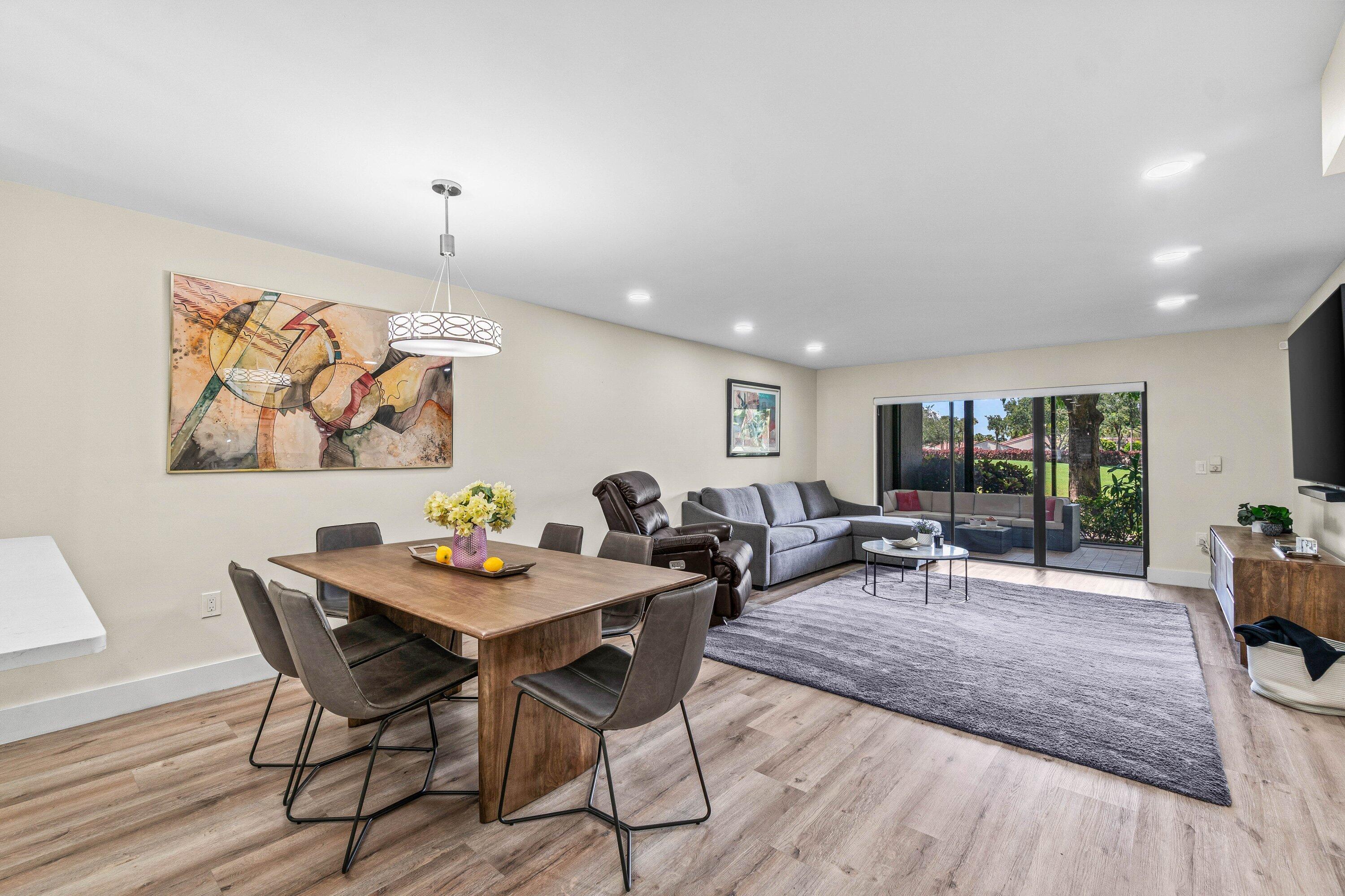 18 Stratford Drive, Unit E Boynton Beach, FL 33436 - Photo 7 of 49 a view of a dining room with furniture window and outside view