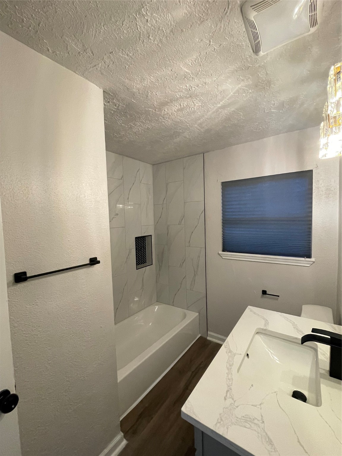 6003 Westover Street Houston, TX 77033 - Photo 11 of 19 a bathroom with a sink and a bathtub